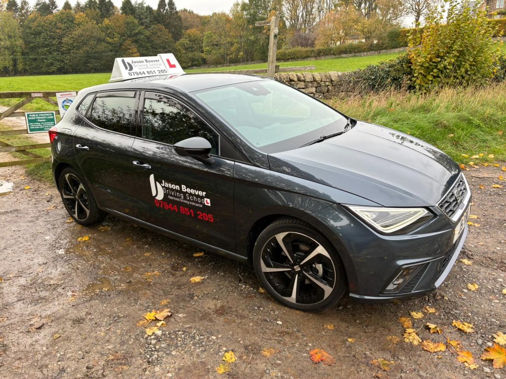 Driving school car parked outdoors