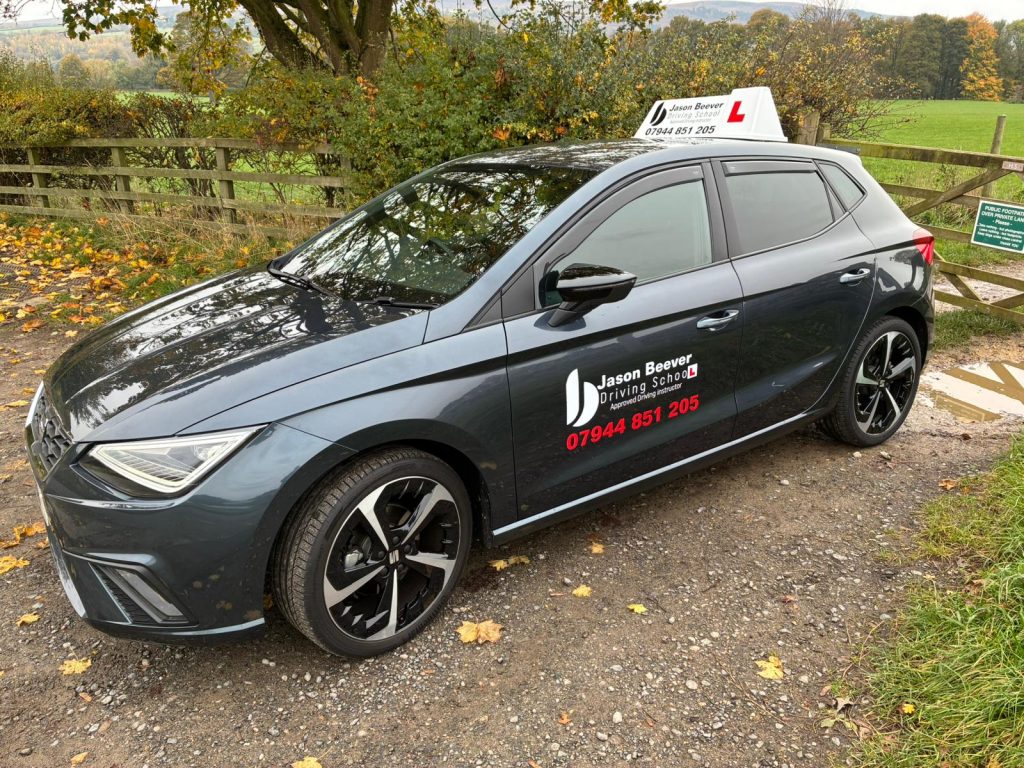Driving school car parked outside
